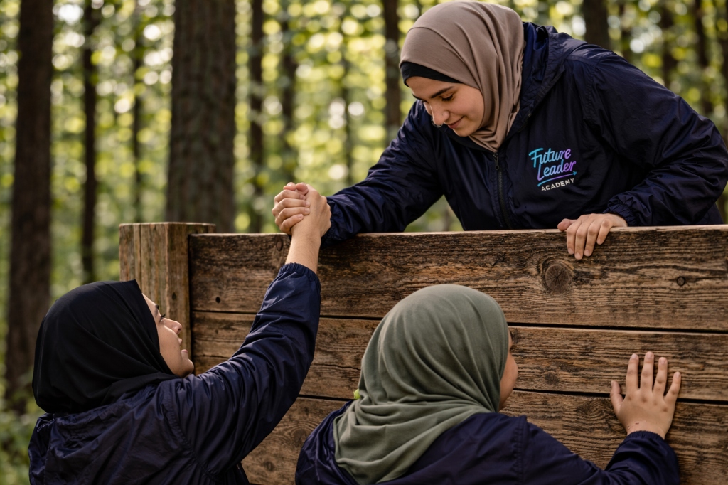 Young people participating in an outdoor challenge