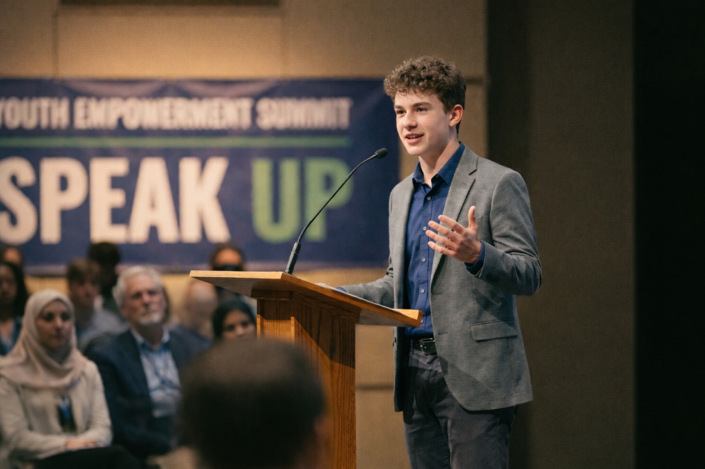 Young student speaking confidently at a Youth Empowerment Summit